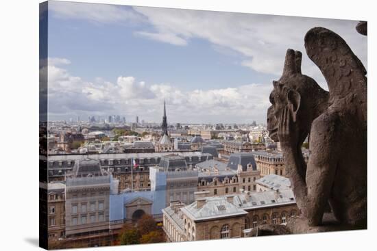 A Gargoyle Stares Out from Notre Dame De Paris Cathedral, Paris, France, Europe-Julian Elliott-Stretched Canvas