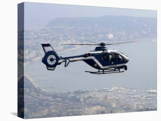 A Gendarme Helicopter is Seen Above the Bay of Cannes-Michel Spingler-Stretched Canvas