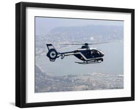 A Gendarme Helicopter is Seen Above the Bay of Cannes-Michel Spingler-Framed Premium Photographic Print