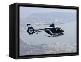 A Gendarme Helicopter is Seen Above the Bay of Cannes-Michel Spingler-Framed Stretched Canvas