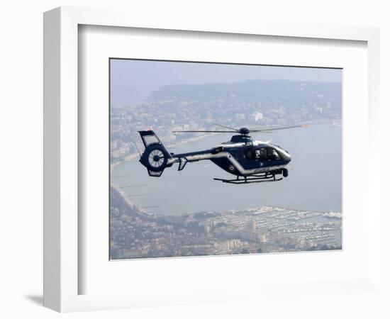 A Gendarme Helicopter is Seen Above the Bay of Cannes-Michel Spingler-Framed Photographic Print