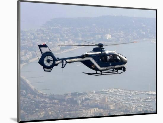 A Gendarme Helicopter is Seen Above the Bay of Cannes-Michel Spingler-Mounted Photographic Print