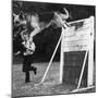 A German Shepherd Police Dog Jumping a Hurdle During a Training Session-null-Mounted Photographic Print