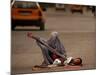 A Girl, 7, Sick with Fever, Lies on a Street-null-Mounted Photographic Print