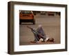 A Girl, 7, Sick with Fever, Lies on a Street-null-Framed Photographic Print