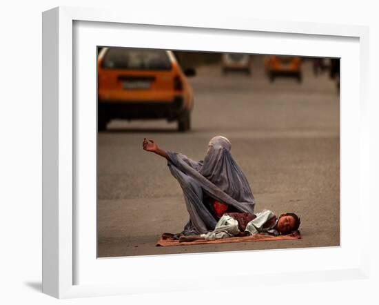 A Girl, 7, Sick with Fever, Lies on a Street-null-Framed Photographic Print