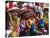 A Girl and Her Friends Smile During a March-null-Stretched Canvas