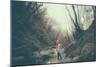 A Girl on a Boulder Looking Towards Camera-Clive Nolan-Mounted Photographic Print