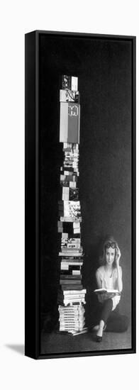 A Girl Reads Beside a Pile of Books-null-Framed Stretched Canvas