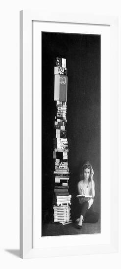 A Girl Reads Beside a Pile of Books-null-Framed Giclee Print