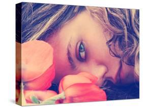 A Girl Resting Her Head on a Table with Flowers Vintage Toned-graphicphoto-Stretched Canvas