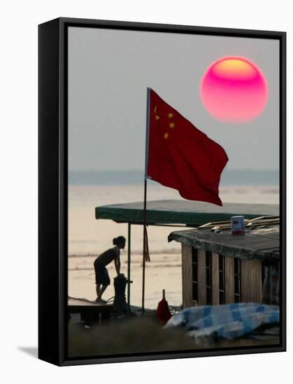 A Girl Rests on a Boat Below the Chinese National Flag-null-Framed Stretched Canvas