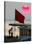 A Girl Rests on a Boat Below the Chinese National Flag-null-Stretched Canvas