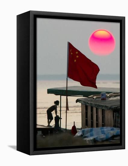 A Girl Rests on a Boat Below the Chinese National Flag-null-Framed Stretched Canvas