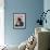 A Girl Rests on a Boat Below the Chinese National Flag-null-Framed Photographic Print displayed on a wall