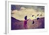 A Girl Walking in a Field with a Flock of Birds Done with a Vintage Retro Instagram Filter-graphicphoto-Framed Photographic Print