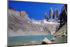 A glacial lake and the rock towers that give the Torres del Paine range its name, Torres del Paine-Alex Robinson-Mounted Photographic Print