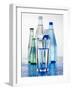 A Glass in Front of Mineral Water Bottles-Alexander Feig-Framed Photographic Print