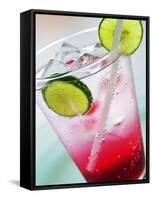A Glass of Raspberry Soda with Ice Cubes and Lime Slices-null-Framed Stretched Canvas