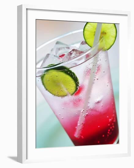 A Glass of Raspberry Soda with Ice Cubes and Lime Slices-null-Framed Photographic Print