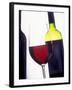 A Glass of Red Wine with a Bottle in the Background-Armin Faber-Framed Photographic Print
