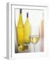 A Glass of White Wine and Wine Bottles in Background-Ulrike Koeb-Framed Photographic Print