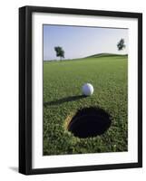 A Golf Ball Just Short of the Hole-null-Framed Premium Photographic Print