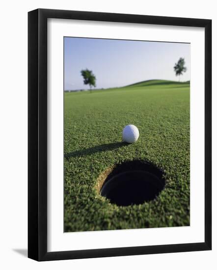 A Golf Ball Just Short of the Hole-null-Framed Premium Photographic Print