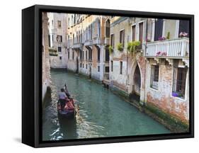 A Gondola on a Canal in Venice, UNESCO World Heritage Site. Veneto, Italy, Europe-Amanda Hall-Framed Stretched Canvas