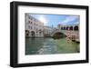 A gondolier rowing under Rialto Bridge in Venice, UNESCO World Heritage Site, Veneto, Italy, Europe-Nando Machado-Framed Photographic Print