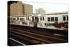 A Graffiti Painted Subway Train with Housing Projects in the Background, May 1973-null-Stretched Canvas