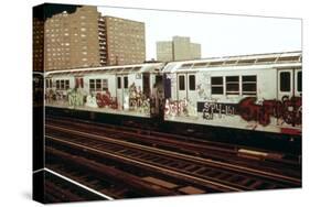 A Graffiti Painted Subway Train with Housing Projects in the Background, May 1973-null-Stretched Canvas