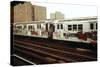 A Graffiti Painted Subway Train with Housing Projects in the Background, May 1973-null-Stretched Canvas