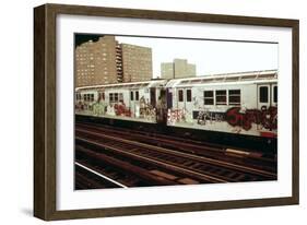 A Graffiti Painted Subway Train with Housing Projects in the Background, May 1973-null-Framed Photo