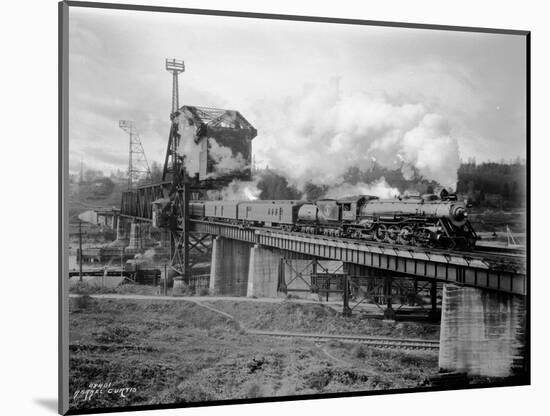 A Great Northern Railway Train on the G.N.R. Bridge across the Lake Washington Ship Canal in Ballar-Ashael Curtis-Mounted Giclee Print