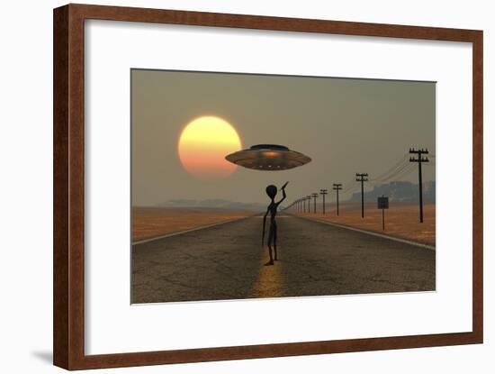 A Grey Alien Hitching a Ride from a Passing Ufo-Stocktrek Images-Framed Art Print