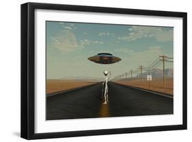 A Grey Alien Hitching a Ride from a Passing Ufo-Stocktrek Images-Framed Art Print