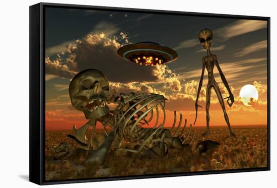 A Grey Alien Looking at Humanoid Remains as a Ufo Flys Overhead-Stocktrek Images-Framed Stretched Canvas