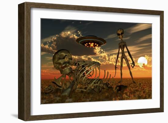 A Grey Alien Looking at Humanoid Remains as a Ufo Flys Overhead-Stocktrek Images-Framed Art Print