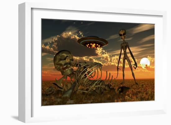 A Grey Alien Looking at Humanoid Remains as a Ufo Flys Overhead-Stocktrek Images-Framed Art Print