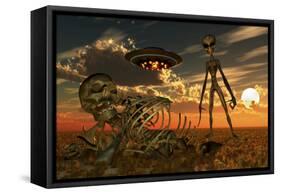 A Grey Alien Looking at Humanoid Remains as a Ufo Flys Overhead-Stocktrek Images-Framed Stretched Canvas