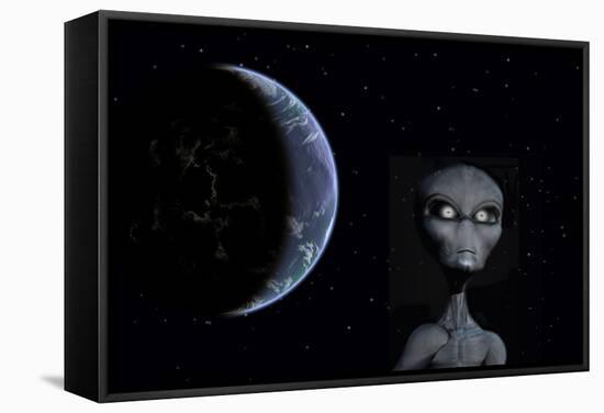 A Grey Alien with Planet Earth in the Background-null-Framed Stretched Canvas
