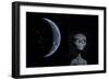 A Grey Alien with Planet Earth in the Background-null-Framed Art Print