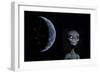 A Grey Alien with Planet Earth in the Background-null-Framed Art Print