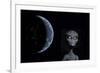 A Grey Alien with Planet Earth in the Background-null-Framed Art Print