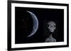 A Grey Alien with Planet Earth in the Background-null-Framed Art Print