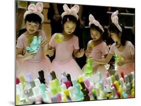 A Group of Girls Dressing as Bunny Rabbits Play with Rabbit Figures-null-Mounted Photographic Print