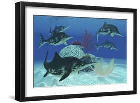 A Group of Large Ichthyosaurus Marine Reptiles Swimming in Prehistoric Waters-null-Framed Art Print
