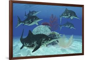 A Group of Large Ichthyosaurus Marine Reptiles Swimming in Prehistoric Waters-null-Framed Art Print