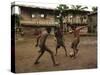 A Group of Panamanian Youths Slide Through the Mud During a Pick-Up Game of Soccer-null-Stretched Canvas